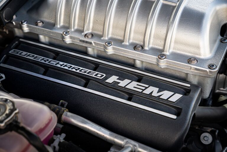 Detailed view of a supercharged HEMI engine showcasing its robust design and engineering.