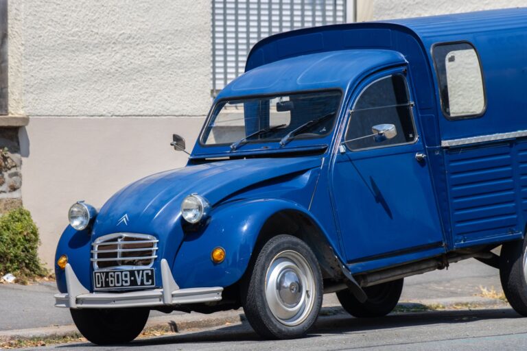 Classic Citroën 2CV van parked in Dol-de-Bretagne, showcasing vintage French automotive design.