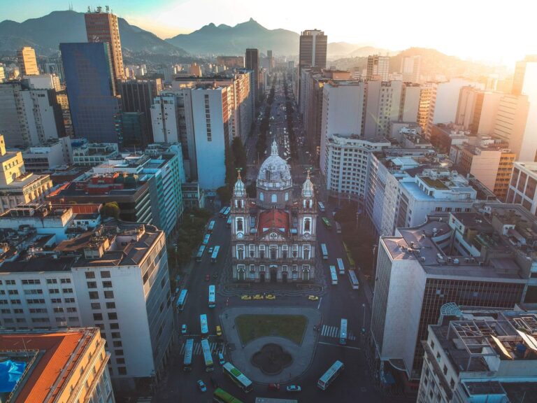 Drone shot capturing the stunning skyline and architecture of Rio de Janeiro with prominent cathedral.