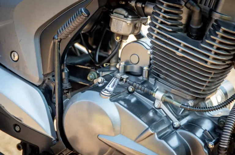 Detailed view of a motorcycle engine showing components and metal textures.