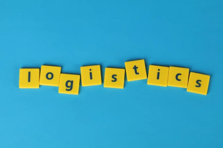 Yellow letter tiles spelling 'logistics' on a vibrant blue background, ideal for business and logistics themes.